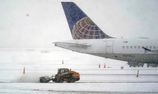 Hundreds of flights cancelled as winter storm hits north-eastern US